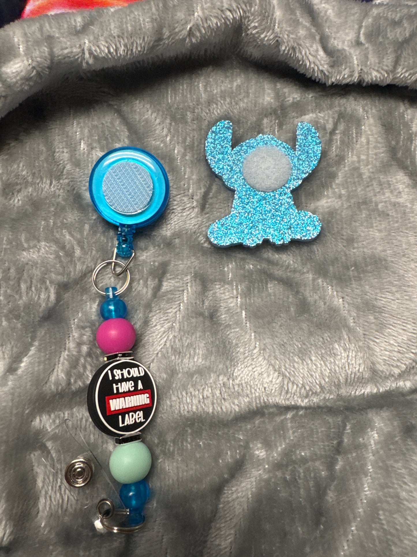 Stitch badge reel